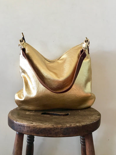 Gold leather evening bag with shoulder strap