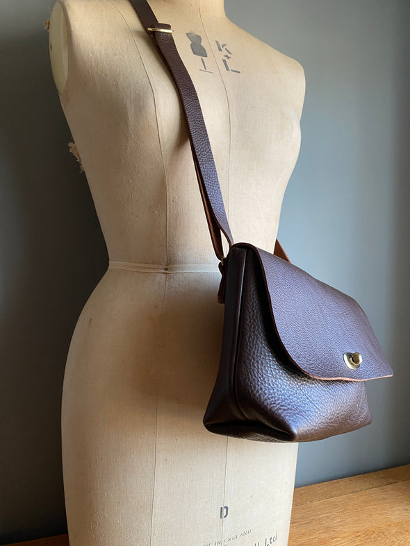 dark brown leather handbag with crossbody strap