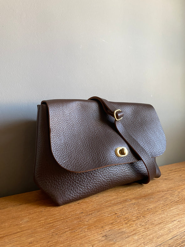 dark brown leather handbag with crossbody strap