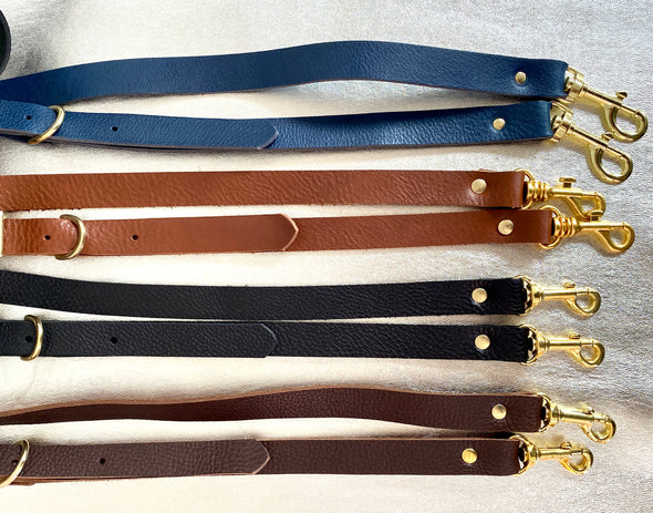 Leather crossbody straps in navy blue, tan brown, black and dark brown