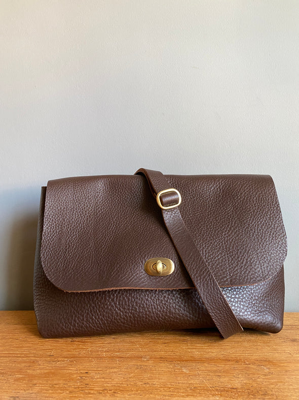 dark brown leather handbag with crossbody strap