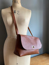 Tan brown leather handbag with crossbody strap