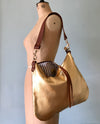 Gold leather evening bag with shoulder strap