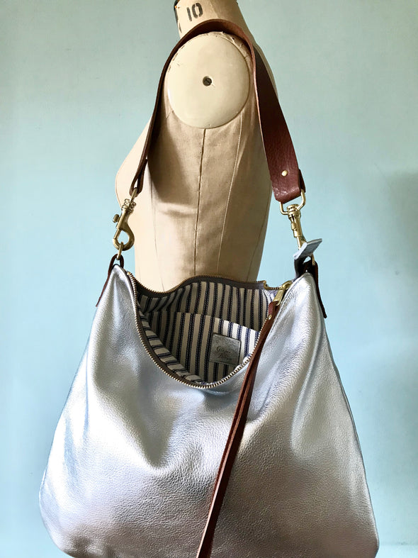 Silver leather Dumpling messenger bag with crossbody or shoulder strap