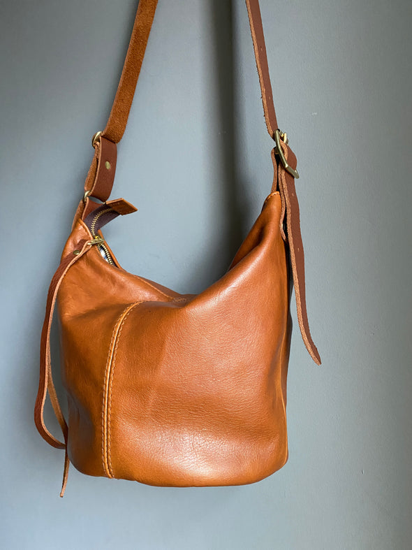 Brown leather Mini Clarissa bucket bag with crossbody strap