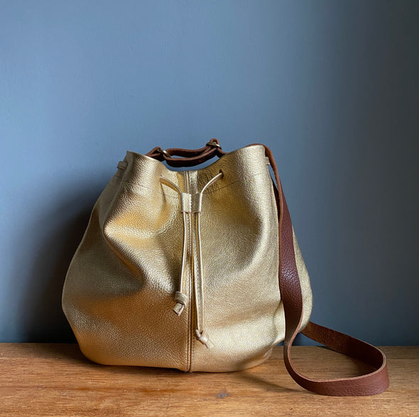 Leather drawstring Edith Plum crossbody bucket bag in gold