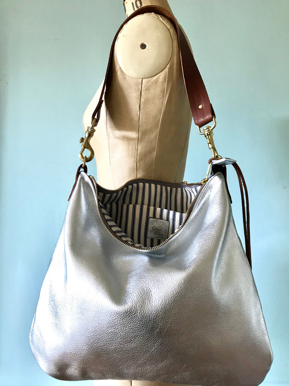 Silver leather Dumpling messenger bag with crossbody or shoulder strap