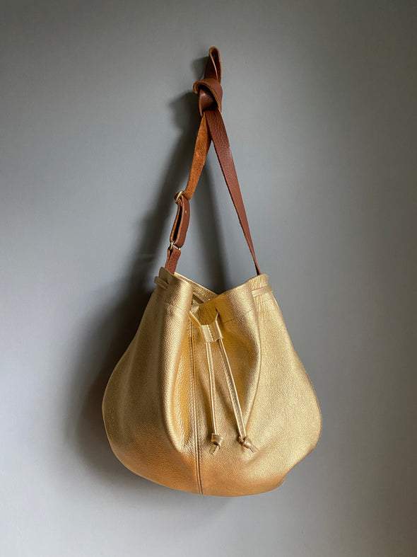 Leather drawstring Edith Plum crossbody bucket bag in gold