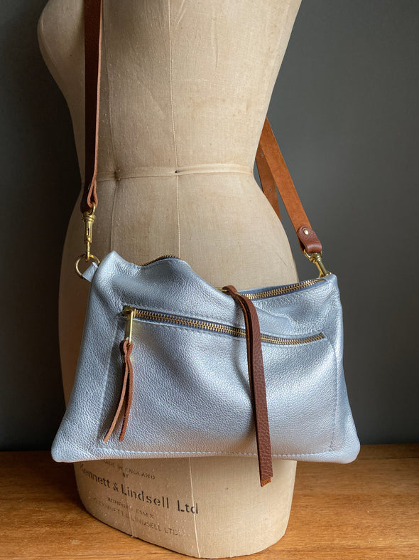 ssbody handbag with zipped exterior pocket and contrasting dark brown strap by Ginger and Brown shown on a vintage tailors dummy.