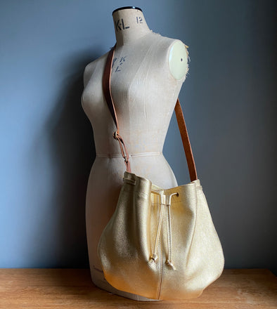 Leather drawstring Edith Plum crossbody bucket bag in gold