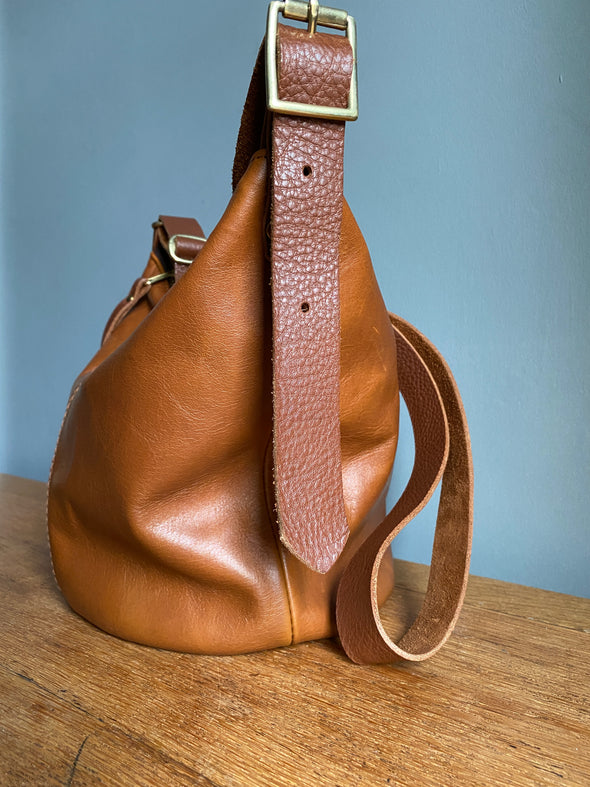 Brown leather Mini Clarissa bucket bag with crossbody strap