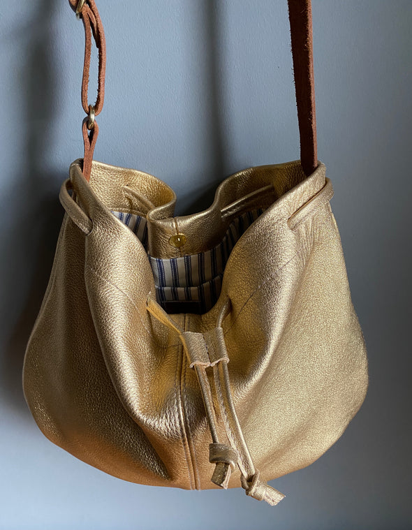 Leather drawstring Edith Plum crossbody bucket bag in gold