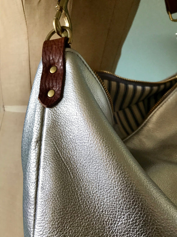 Silver leather Dumpling messenger bag with crossbody or shoulder strap