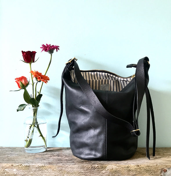 Black leather Clarissa bucket bag with crossbody strap