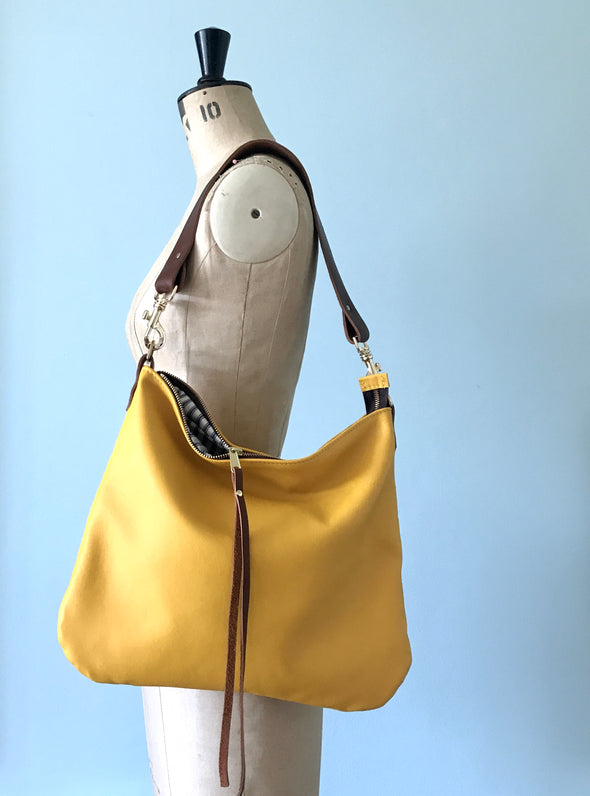 Dumpling messenger bag in yellow - crossbody / shoulder bag