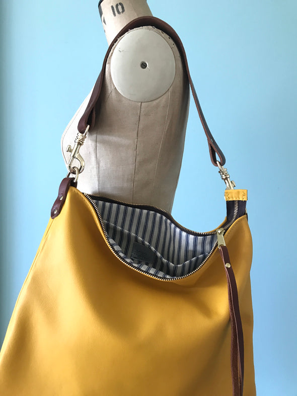 Dumpling messenger bag in yellow - crossbody / shoulder bag