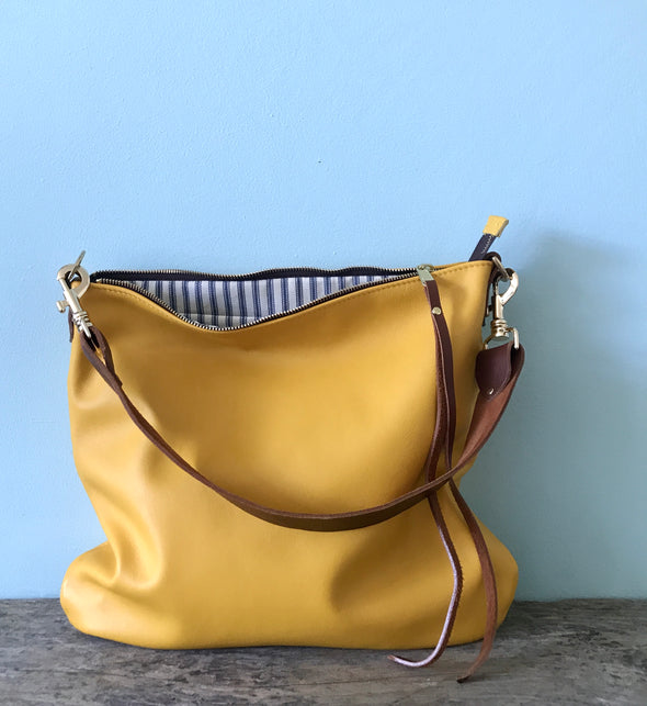 Dumpling messenger bag in yellow - crossbody / shoulder bag