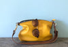 Yellow leather purse with shoulder strap