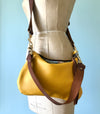 Yellow leather purse with shoulder strap  