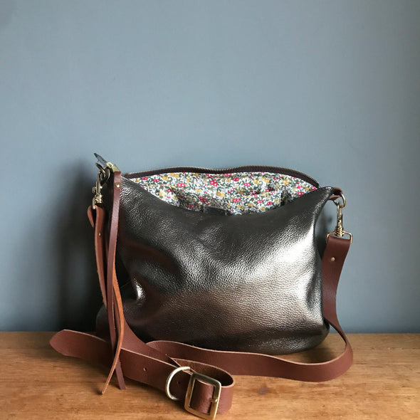 Dumpling messenger bag in gunmetal leather - crossbody / shoulder bag