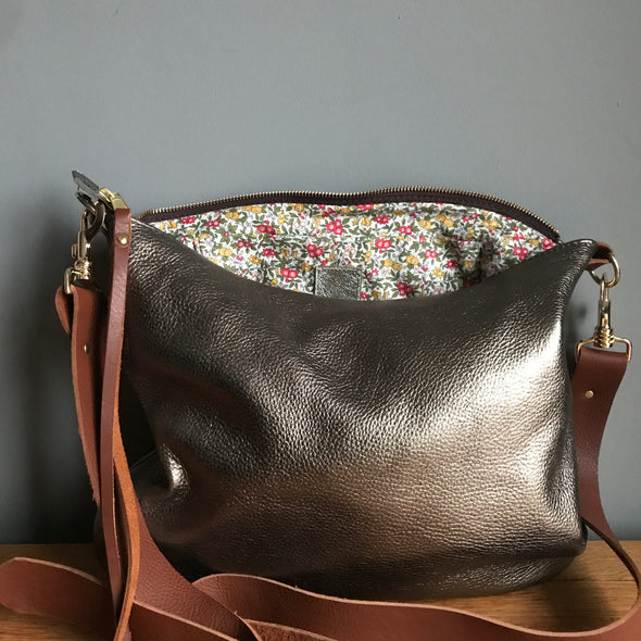 Dumpling messenger bag in gunmetal leather - crossbody / shoulder bag