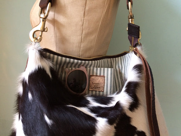 Dumpling messenger bag in cowhair and leather