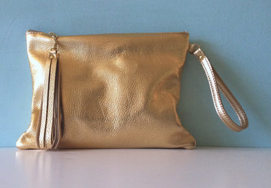 Bright gold leather Clarke clutch with wristlet handle