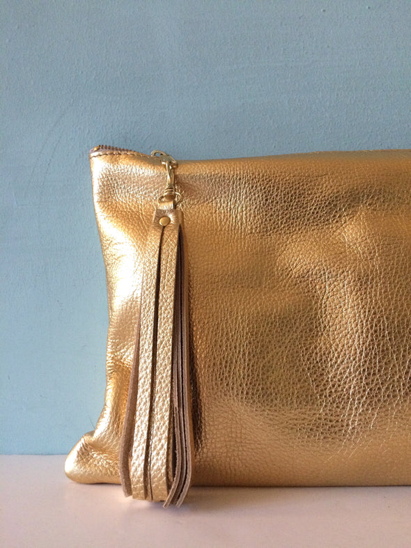 Bright gold leather Clarke clutch with wristlet handle