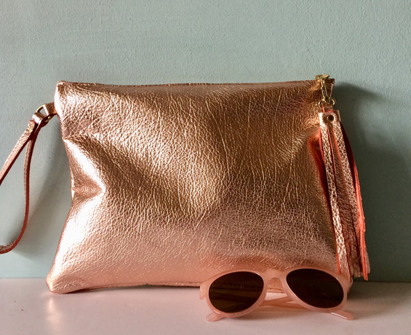 Rose gold leather Clarke clutch with wristlet handle