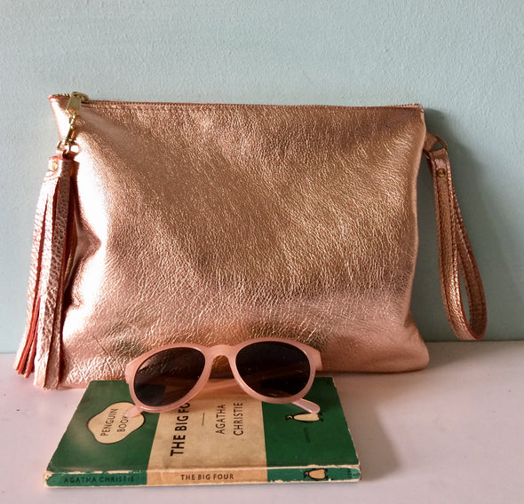 Rose gold leather Clarke clutch with wristlet handle