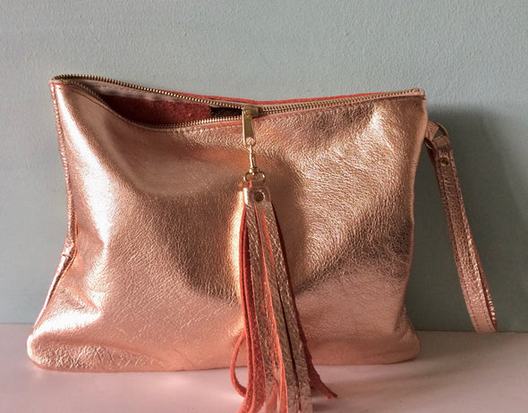 Rose gold leather Clarke clutch with wristlet handle