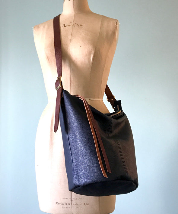 Navy blue leather Clarissa bucket bag with crossbody strap