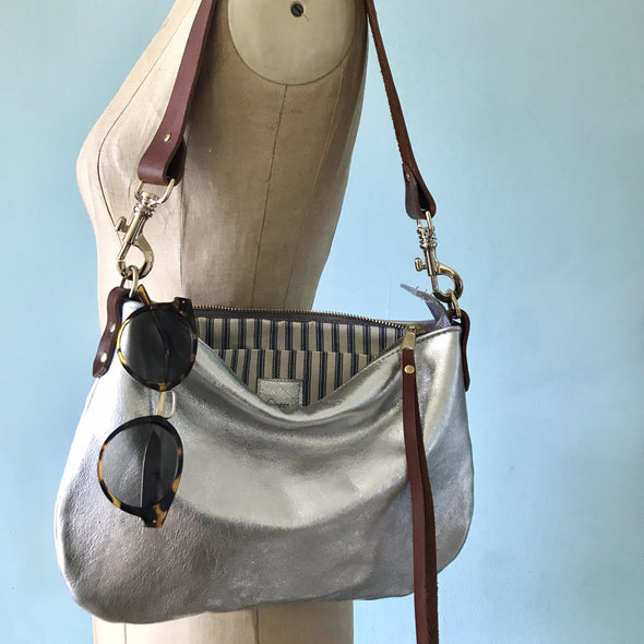 silver leather handbag with shoulder strap