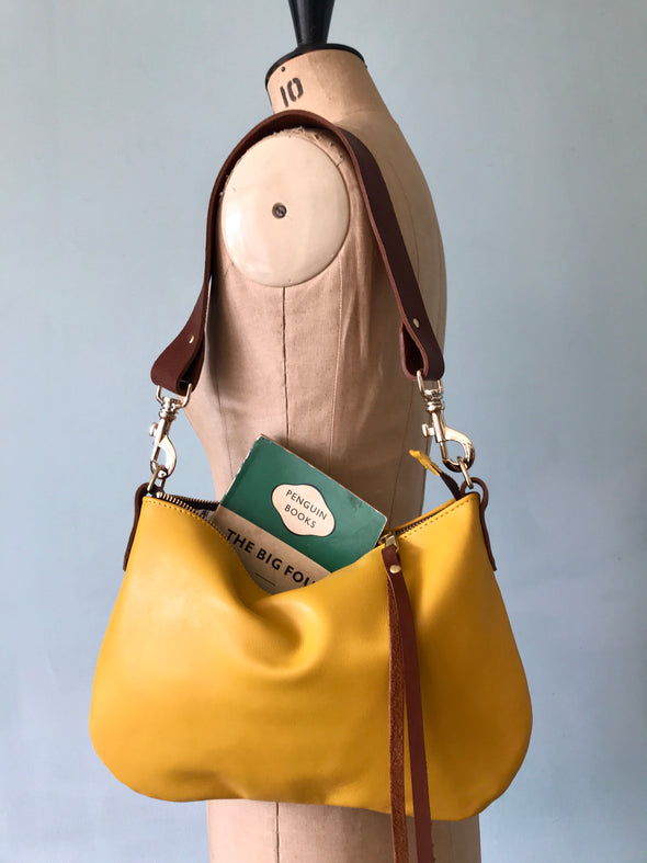 Yellow leather purse with shoulder strap