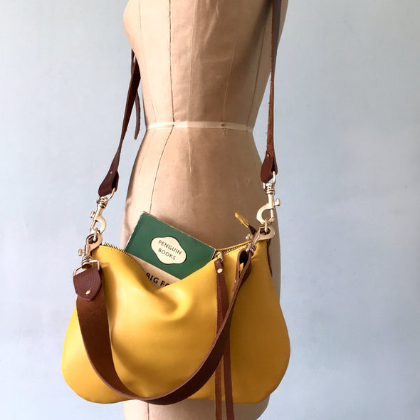 small bright yellow handbag with crossbody and shoulder strap