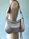 silver leather bag with shoulder strap