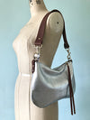 silver leather bag with shoulder strap  Edit alt text