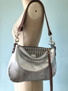 Small silver leather handbag with shoulder strap 